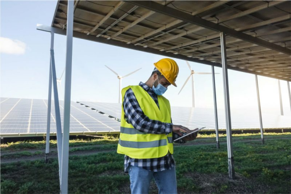 Engineer modelling a system on a tablet